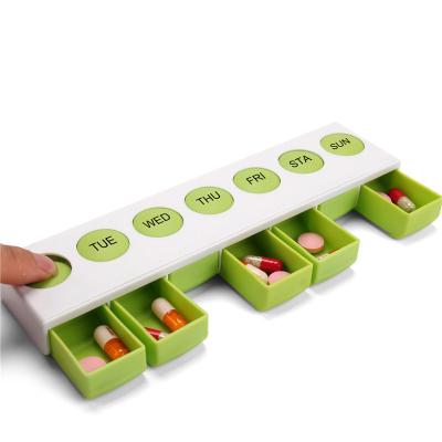 China Spring Push Button Eco-friendly Weekly Pill Organizer Easy Open Case Portable 7 Day Pill Container Medicine Box Vitamin Organizer for sale