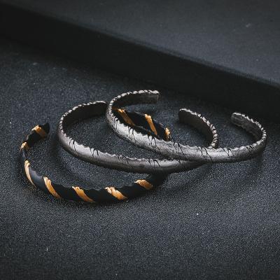 China Original tide brand personality iron punk wire wrapped bracelet men and women opening bracelet jewelry irregular striped wholesale for sale