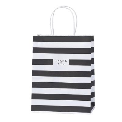 China Recyclable Portable Stripe Color Paper Bag Gift Clothing Portable Shopping Bag for sale