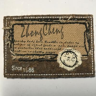 China Sustainable Custom Jeans Leather Patches Embossed Brand Genuine Brown Leather Label Patch Clothing Label for sale