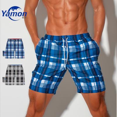 China Custom Sublimation Printed Fashion Anti-wrinkle Mens Swim Trunks Mens Swimwear With Compression Liner for sale