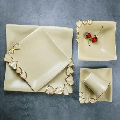 China Sustainable Luxury Gold Embossed Heart Custom Design Dinnerware Royal Style Bone China Dinnerware Set Square China Dinnerware for sale