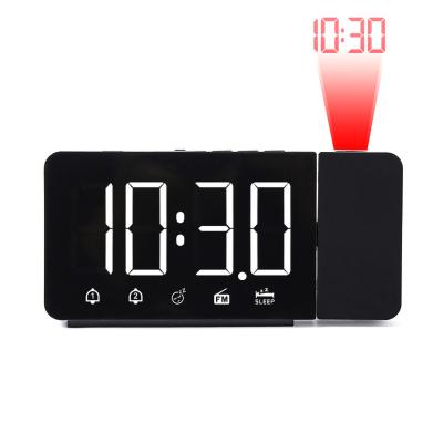 China Amazon Radio Hot Selling Digital LED Digital Desk Table FM Radio Clock Laser Projection Electronic Alarm Clock for sale