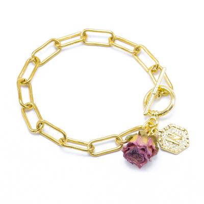 China Hiphop Fashion Jewelry 18K Gold Plated Carabiner Restriction-Chain Bracelet With Yellow Dried Flower Charms for sale