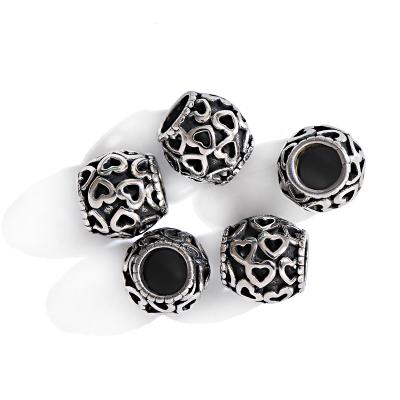 China Eco-Friendly Big Black Hole Big Size Round Beads Hollow Heart Engraved Gunmetal Charms Stainless Steel Spacer Beads for sale