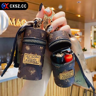 China Luxury Waterproof Creative Leather Pouch Pendant Lipstick Key Chain Purse Holder Bag Lipstick Key Chain Travel Brand Chain With Scarf for sale