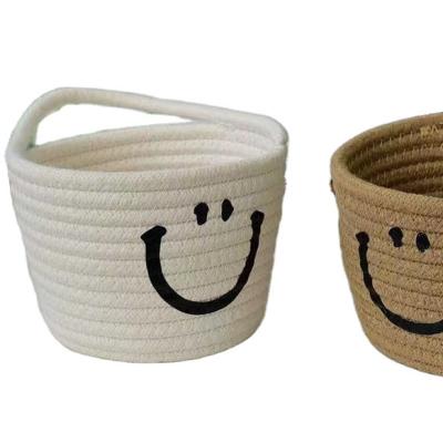 China Modern Wholesale Viable Fashion Cotton Rope Storage Basket Can Be Wall Hanging Smiling Face Storage Basket for sale