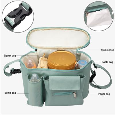 China Comfortable Outdoor Travel Diaper Bag Large Capacity Baby Carriage Mommy Carriage Lighter and Hanging Bag for sale