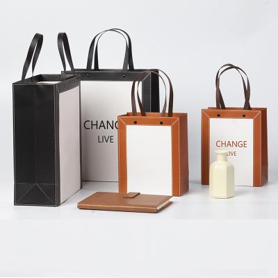 China A recyclable durable shopping paper bag for multiple industries that can hold gifts, shoes and luxury goods for sale