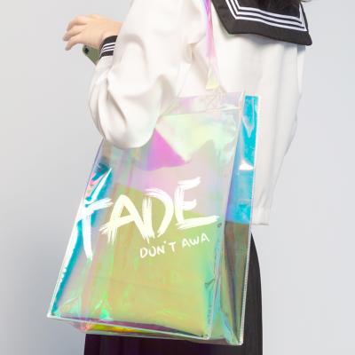 China Celebrity Reusable Transparent Insist With Hand Dress Jelly Laser PVC Tote Bag for sale