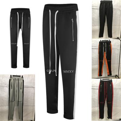 China Anti-pilling new retro tapered polyester paneled casual custom design track pants for men for sale