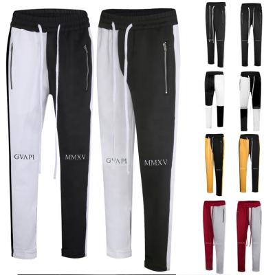 China Anti-pilling mens streetwear fusion color splicing slim fit with side bands ankle buttons sports zipper design track pants for sale