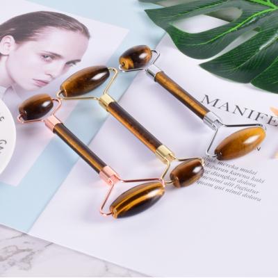 China 100% Facial Face Lift Tiger Eye Jade Roller Massager Tool With Customized Box for sale