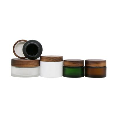 China Household empty jar with wooden cover wooden cosmetic jar frosted glass jar with wooden lid for sale