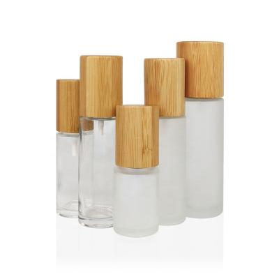 China 30ml 40ml 50ml 60ml 100ml 150ml Household Foundation Refillable Empty Glass Liquid Lotion Pump Bottle With Bamboo Lid for sale