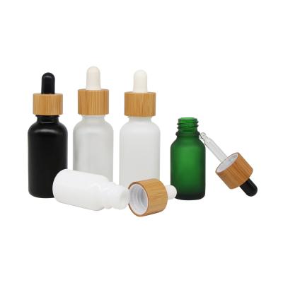 China Black Bamboo Cosmetic Packaging Bottle Cap Serum Bottle Frosted Glass Press Bamboo Dropper for sale