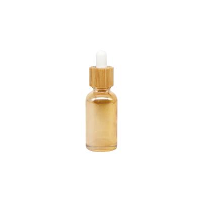 China New type eco-friendly cosmetic packaging shiny body glass bamboo bottle 30ml colorful bamboo bottle for sale