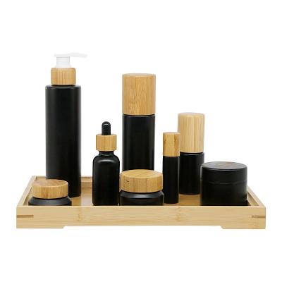 China Biodegradable Material 2021 Sustainable Cosmetic Packaging Full Color Black Packaging Set Bamboo Jar And Bottle for sale