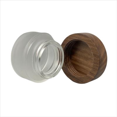 China 30ml cosmetic packaging eco-friendly bamboo wooden lid glass jar for face cream for sale