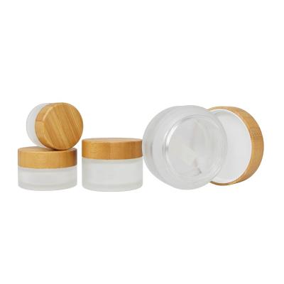 China Hot Selling Engraved Bamboo Skin Care Cream Jar With Screw Bamboo Lid Frosted Bamboo Glass Jar Lid for sale