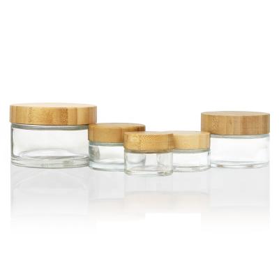 China Natural Bamboo Lid Design 100g 150g 250g Skin Care Cream Jar With Bamboo Lid Bamboo Cosmetic Jar Frosted Glass 250g for sale