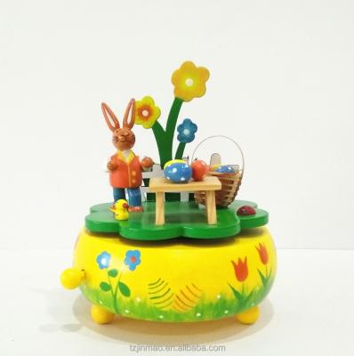 China Bunny Picnic Wooden Rotating Wind-up Mechanism Operated Hand Crank Music Box with Easter Egg Basket for sale