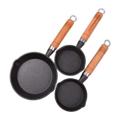 China Kitchen Restaurant Outdoor Bakery Chef-cookwares High Quality Wooden Handle Pre-Seasoned Round Cast Iron Non-Stick Cookware Frying Pan Three Pieces Sets for sale