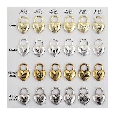 China LUXURY BRAND LOGO k80-85  nail parts metal material vintage Gold Silver Japan korea style Lock design metal logo nail art decoration for sale