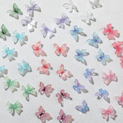 China Resin 2023 Nail Butterfly Jewelry Hot selling Fairy 3D Versatile Translucent Ribbon Resin Bow Nail Accessories Wholesale for sale