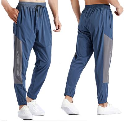 China Anti-wrinkle 2022 spring and autumn men's sports pants quick-drying leisure running loose waist training fitness pants more breathable for sale