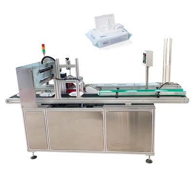 China Hotels Wet Machinery Non Woven Disposable Wet Cloth Towel Packing Wet Towel Machine for sale