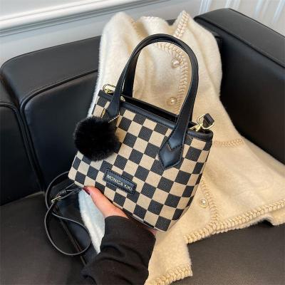 China 2022 autumn/winter new tide small one-shoulder bag handbag solid color net red french cross fashion lady bag fashion lady bag for sale