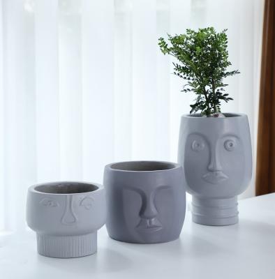 China Art Decor Hot Promotion Light Small Weight Human Face Planter Box Concrete Flower Pot For Garden for sale