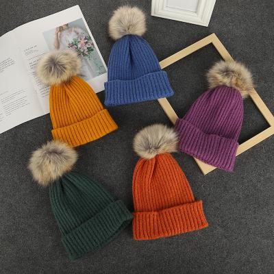 China Custom COMMON Ball Pom Pom Beanies Hat Embroidery Logo Knitted Beanie Winter Hats Faux Raccoon Fur Adults Kids for sale