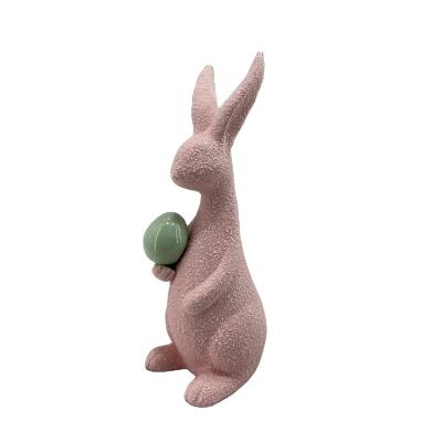 China Ceramic pink ceramic bunny with egg for Easter decoration for sale