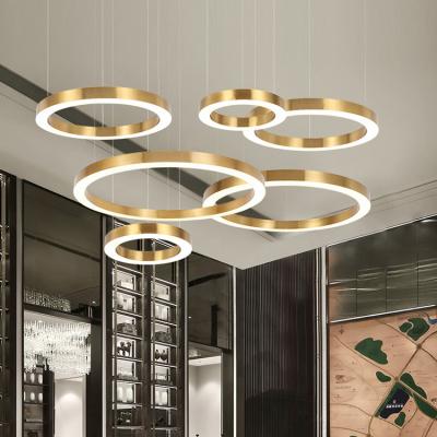 China Fashion Decoration Simple Hanging Circle Rings Acrylic Gold Chandelier Luxury Modern Led Light for sale