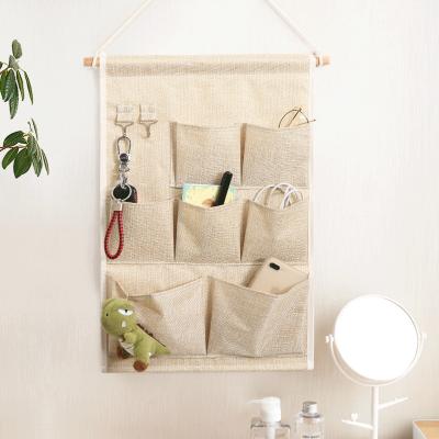 China Portable Hanging Organizer Wall Hanging Cotton Pocket Dormitory Simple Cabinet Modern Canvas Storage Bag for sale