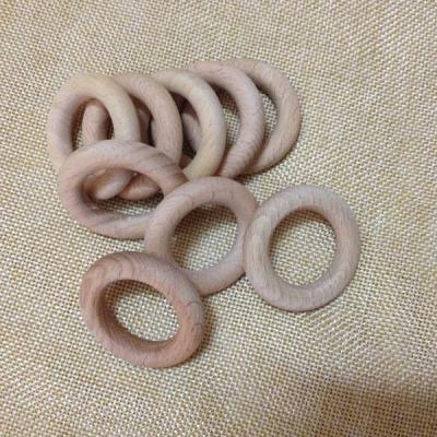 China Soft Toy 40 mm Customized Round Wooden Teethers Wooden Rattle Rings Baby Rings for sale