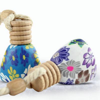 China Eco Sustainable Polymer Clay Hanging Bottle With Wooden Cap Air Freshener for sale