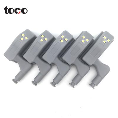 China TOCO Modern Lamp Universal Cabinet Hinge Led Interior Light Sideboard White Wardrobe Induction Lamp Led Hinge Light for sale