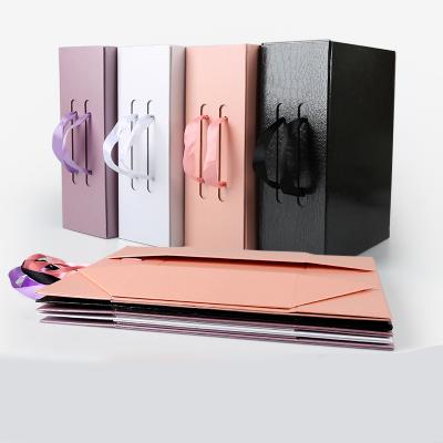 China Recycled Materials High End Customized Makeup Cardboard Foldable Flat Mailing Gift Box With Handle for sale