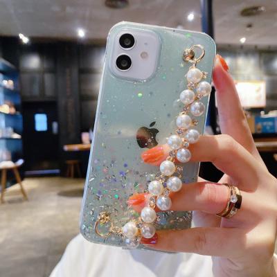 China Hot Selling Shockproof Transparent Soft Tpu Cell Phone Strap Holder Wristband Glitter Case For iphone X XS XR XSMAS 12/11 13 pro max for sale