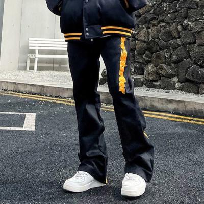 China Anti-wrinkle Custom Flare Leg Sweat Pants Men OEM Streetwear Jogger Plain Black Embroidery Logo Baggy Flare Pants for sale