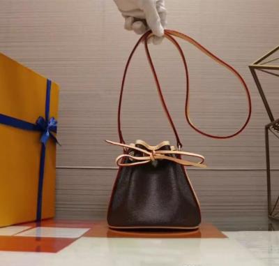 China Motion Sensing Classic Mini Drawstring Bucket Bag Real Leather Lady Crossbody Bag Mobile Wallet Fashion Satchel Shoulder Bag Handbag Retro for sale