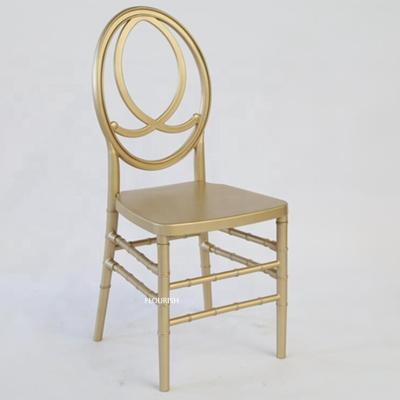 China Stacking Resin Phoenix Golden Chair With White Removable Cushion For Wedding Banquet for sale