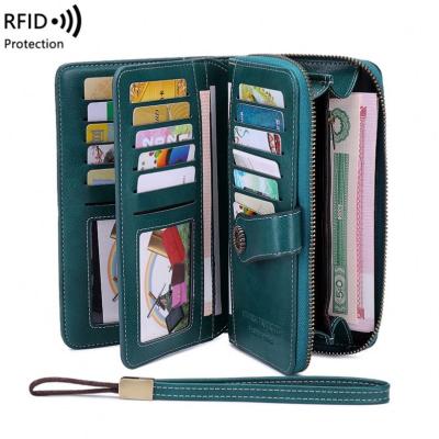 China Large capacity rfid wallet woman long hollow ladies RFID clutch wallet zipper wallets multifunction card bag leather rfid wallet for sale