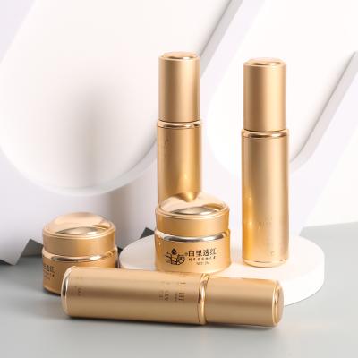 China Wholesale Newest Custom Cosmetic Packaging Logo Label Shampoo Airless Pump Bottle 40ml 200ml White And Gold Brown Luxury Set for sale