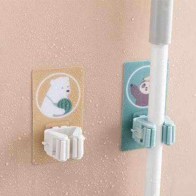 China Modern Strong And Seamless Broom Holder Broom Card Holder Broom Hook No Sticky Broom Clip Bathroom Wall Cartoon Punch Hook for sale