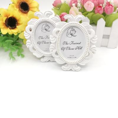 China Wedding Party Decoration Favors Wholesales OEM White Oval Baroque Photo Frame Place Card Holder Wedding Party Decoration Favors for sale