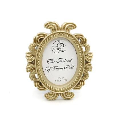 China Wedding Party Decoration Favors Wholesales OEM Gold Oval Baroque Photo Frame Wedding Favors Elliptical Gold Picture Frame Event Party Supplies for sale